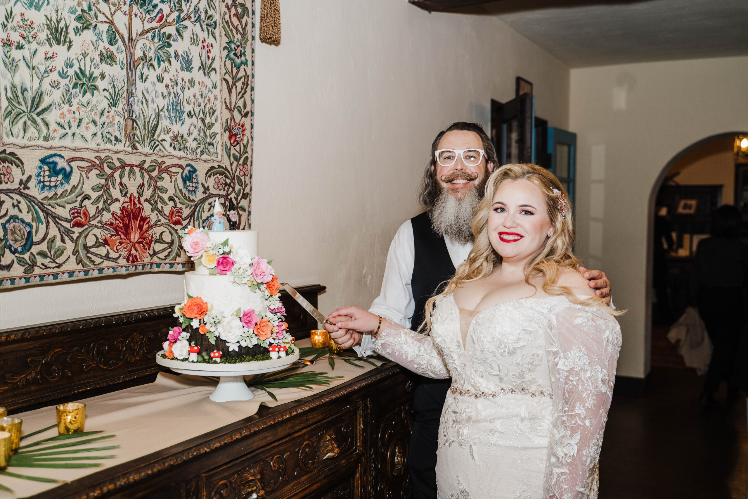 couple cuts their wedding cake at casa feliz