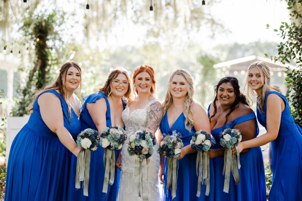 bridesmaids smiling at camera